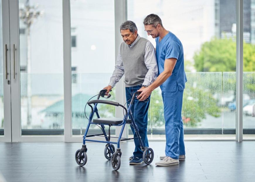 improving mobility impairment one step time shot nurse helping senior man with walker